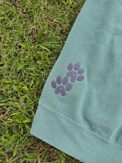 Light Green Comfort Color Sweater with AA Paws Logo Embroidered on bottom back in Charcoal thread on Grass 